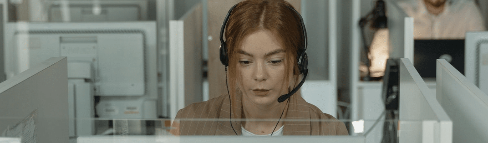 A cuatomer support Woman in Brown Blazer Working in the Office