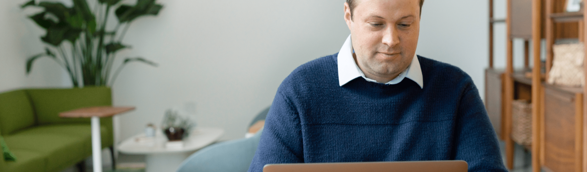 A salesman Using a Laptop Indoors
