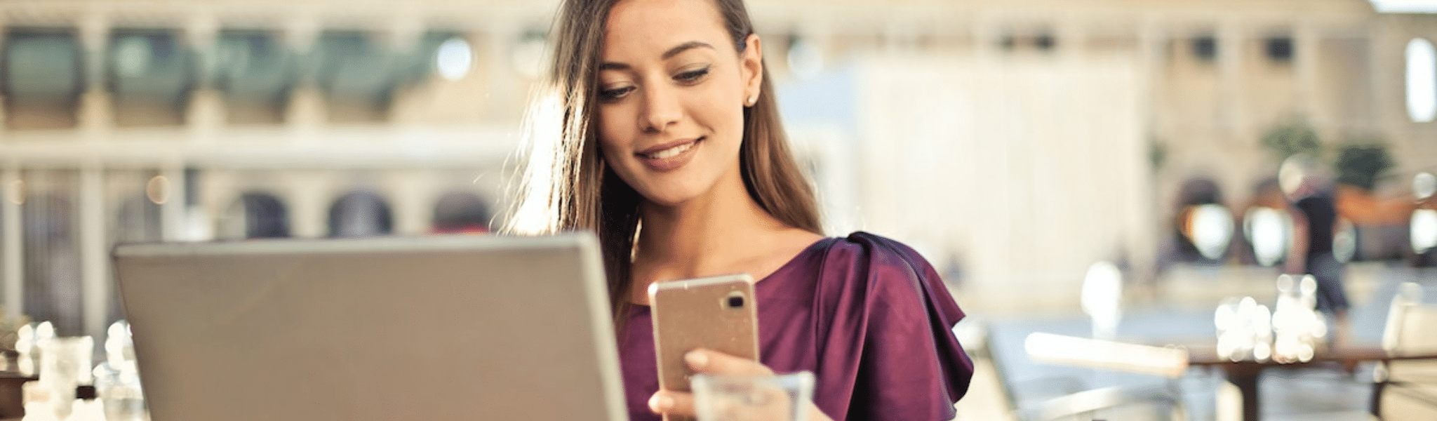 Woman Wearing Purple Shirt Holding Smartphone White Sitting on Chair